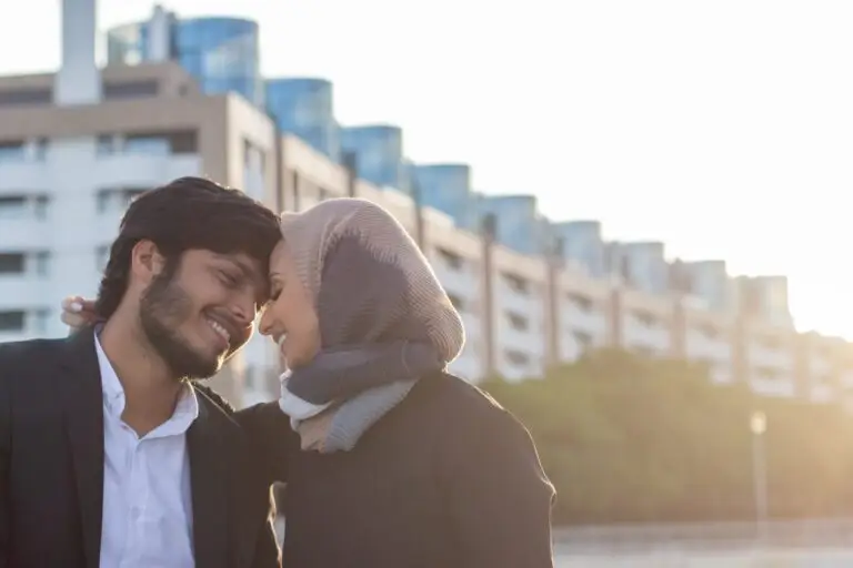 fond-arabic-couple-spending-time-together-woman-with-covered-head-bright-make-up-man-suit-sitting-bench-being-tender-with-each-other-love-affection-concept-min-scaled-1