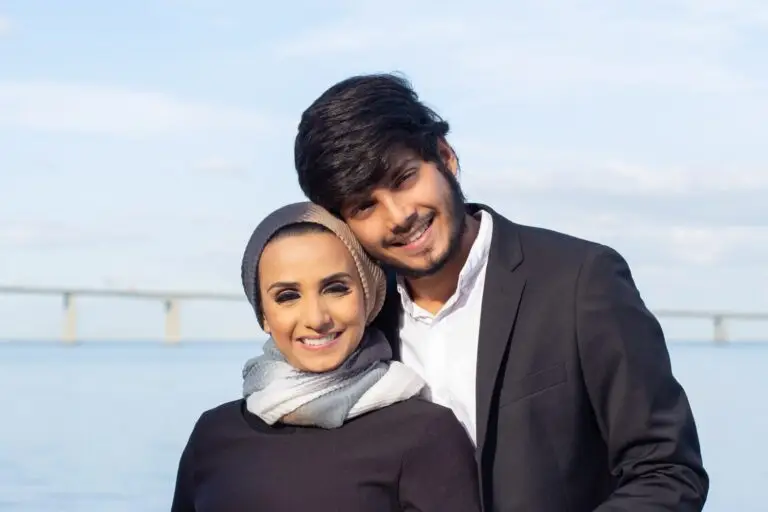portrait-loving-arabic-couple-during-walk-woman-with-covered-head-bright-make-up-man-suit-smiling-camera-hugging-love-affection-concept-min-scaled-1